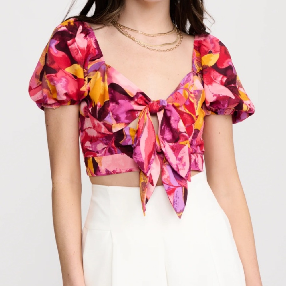 New with tags. size medium crop top with two ties in the front.